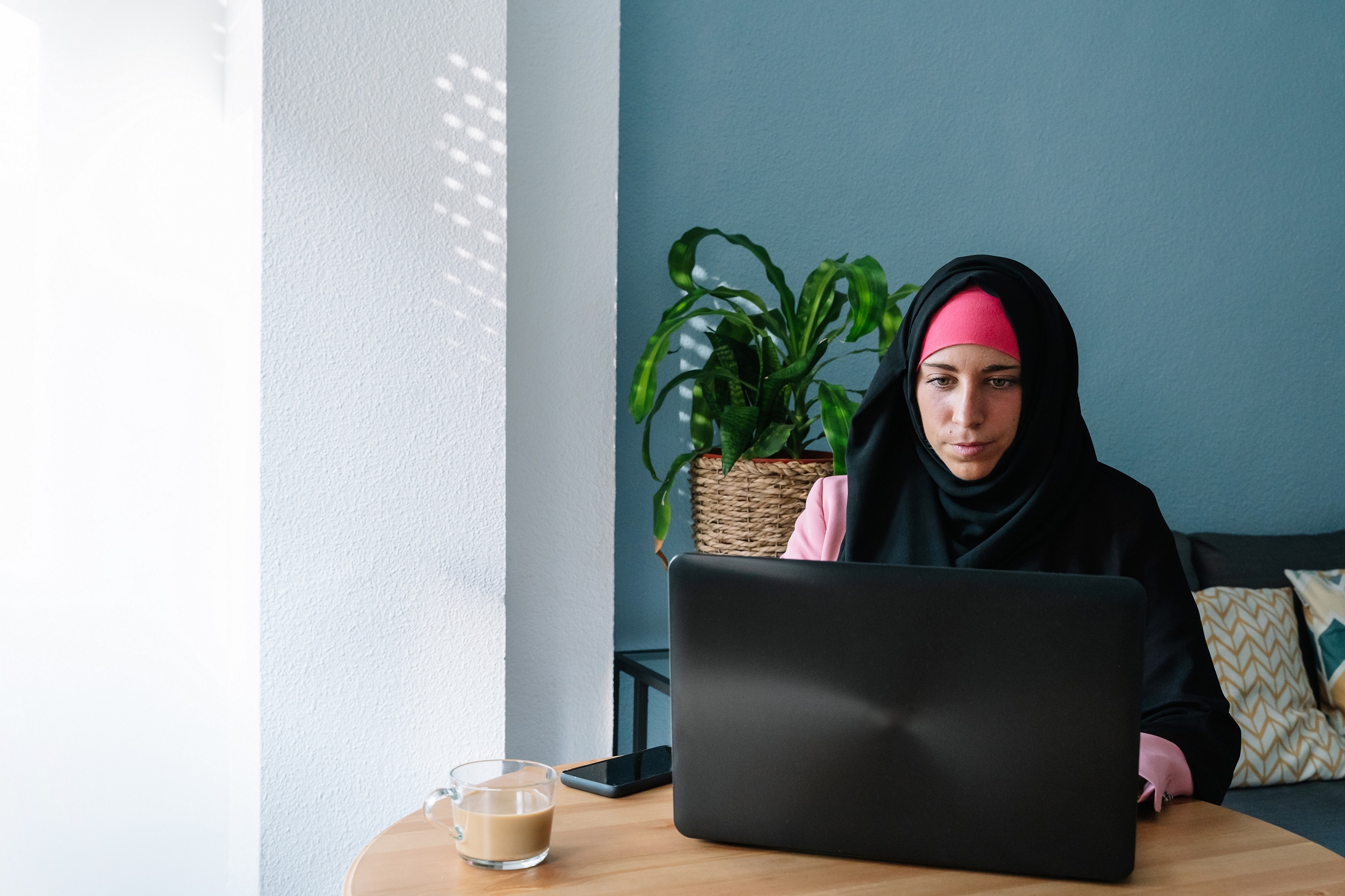 A young woman working on a laptop