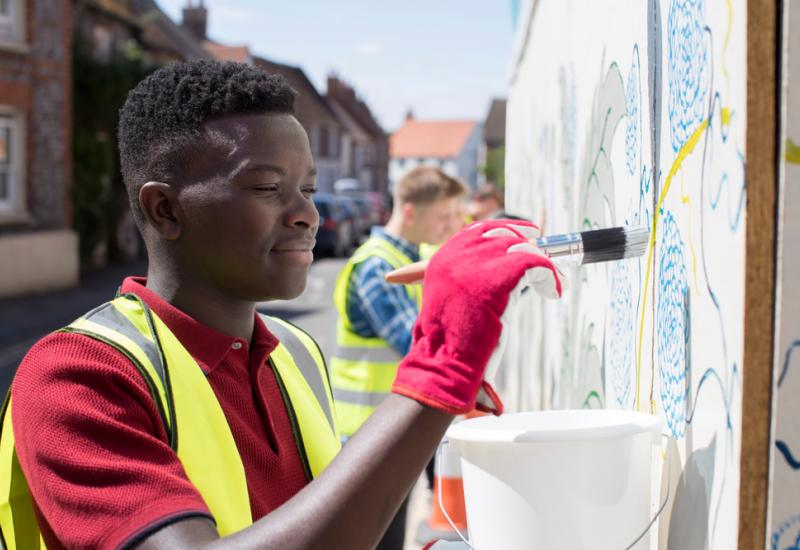 A person taking part in a community art project