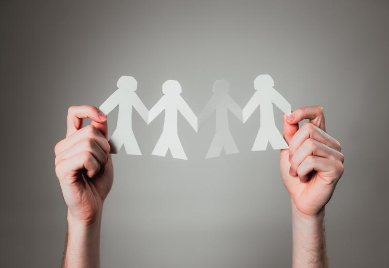 Paper cut outs of people