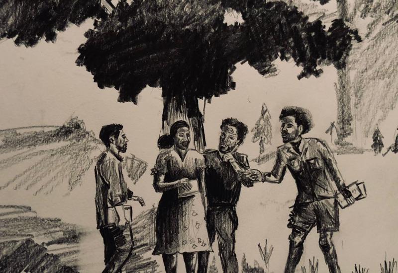 Four people standing under a tree and engaging in conversation.