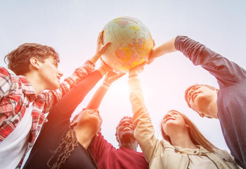 People holding a globe