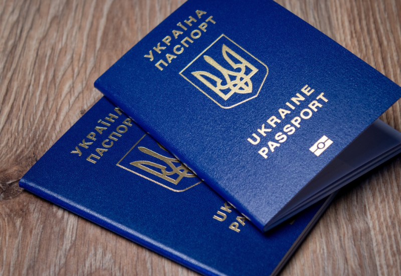 Two Ukrainian passports on a table.