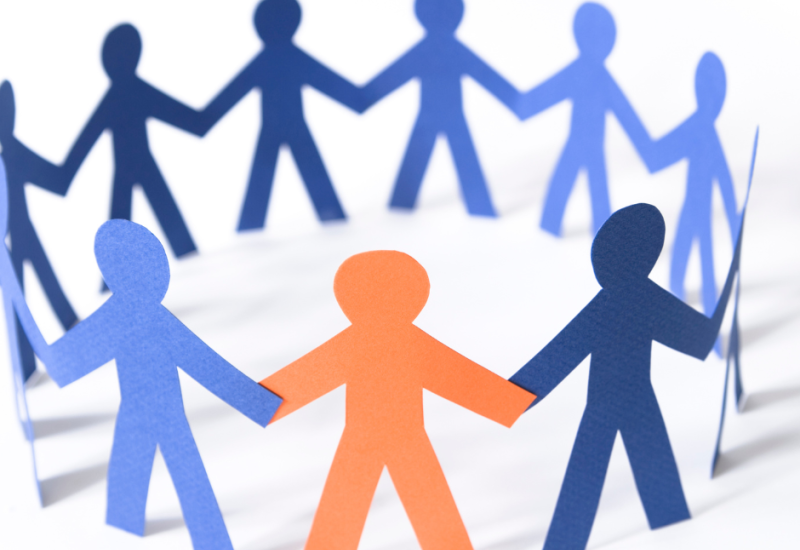 A circle of paper people.