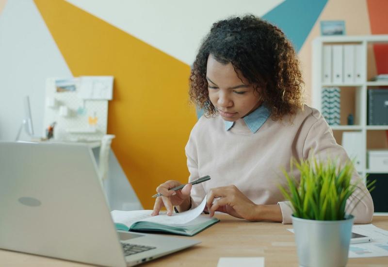 office worker taking notes on paper