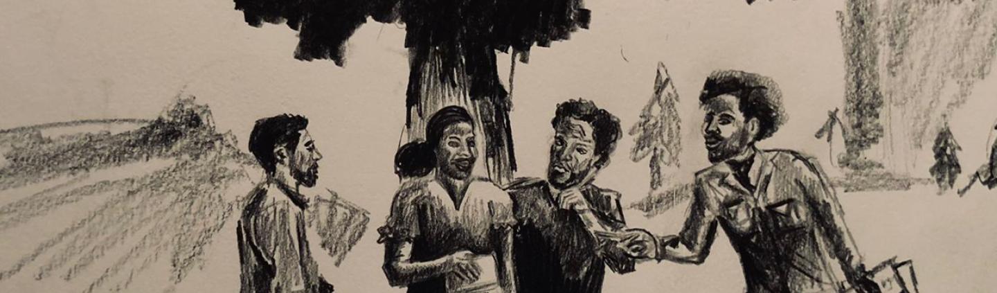 Four people standing under a tree and engaging in conversation.