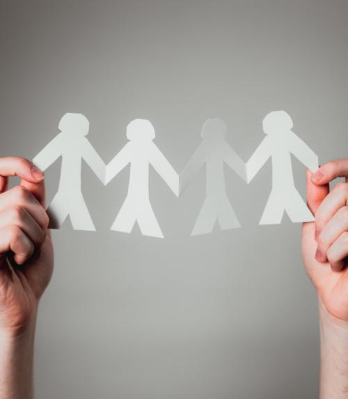 Paper cut outs of people