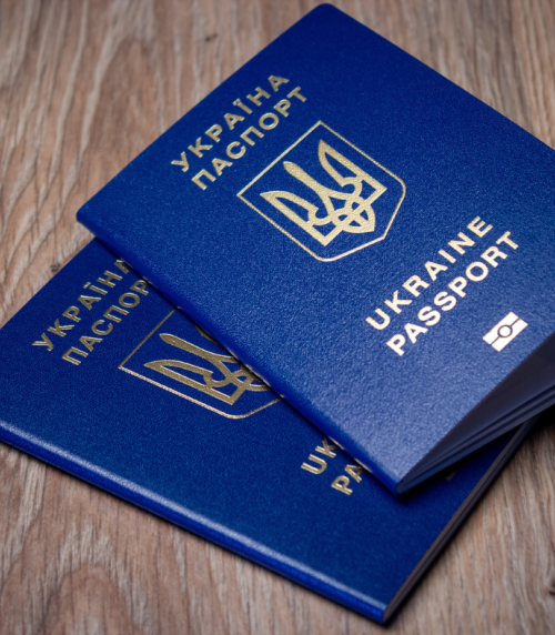 Two Ukrainian passports on a table.