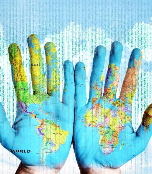 Image of world map painted on hands held out. 