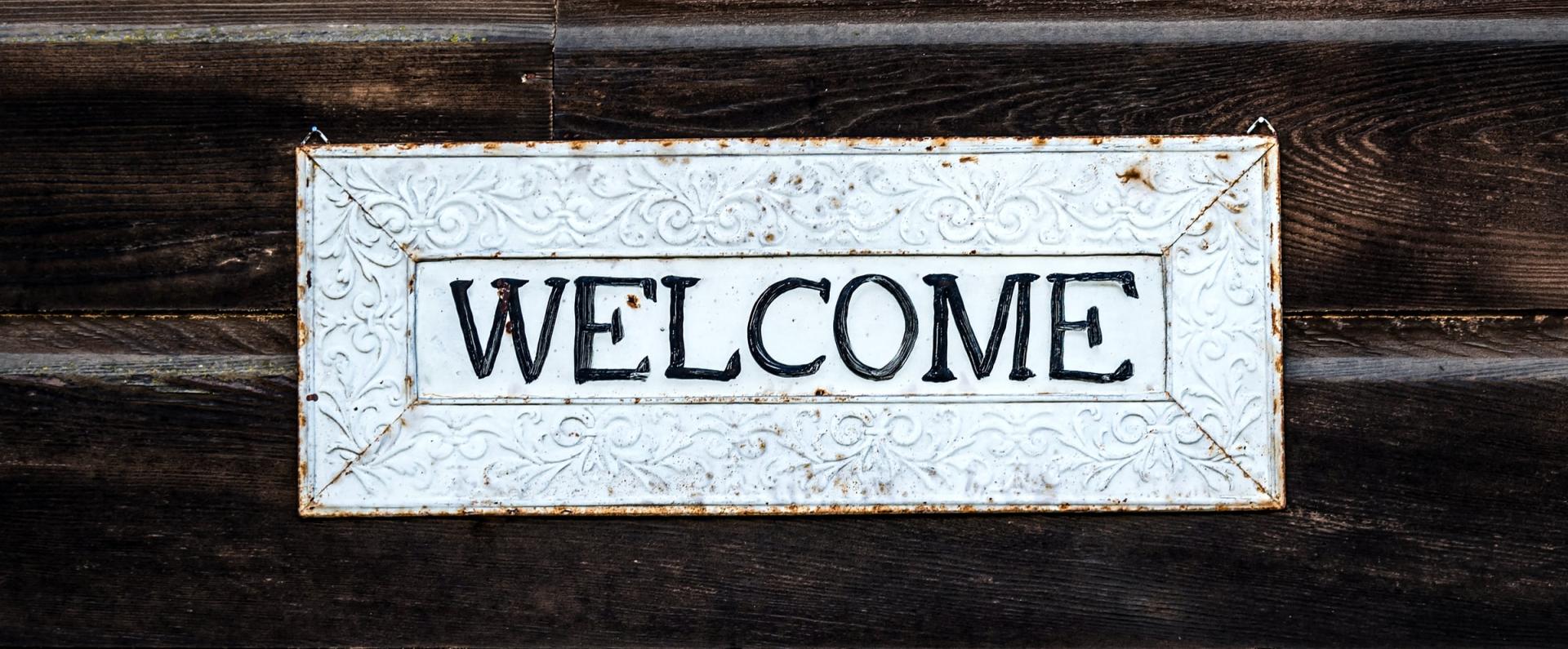 Welcome sign on wall